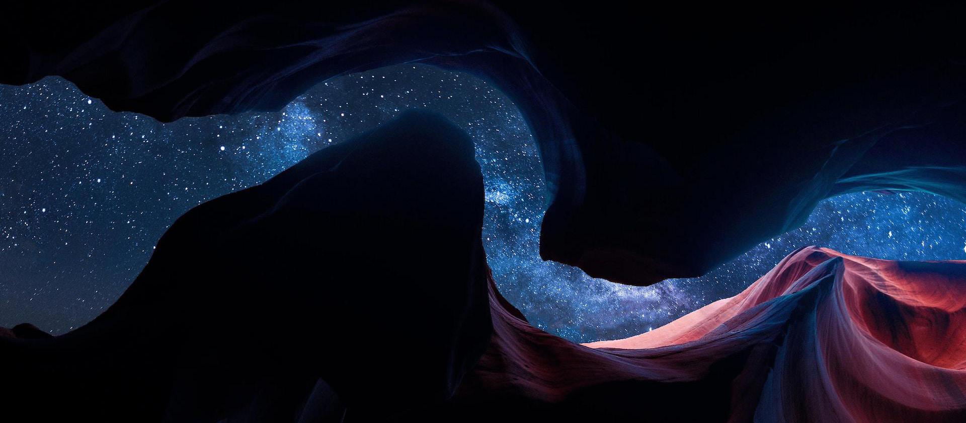 Image of looking up out of a slot canyon, seeing the stars above.